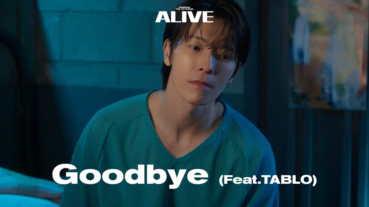 Still from the Goodbye music video — DONGHAE in a teal-lit room, the album's ALIVE wordmark above